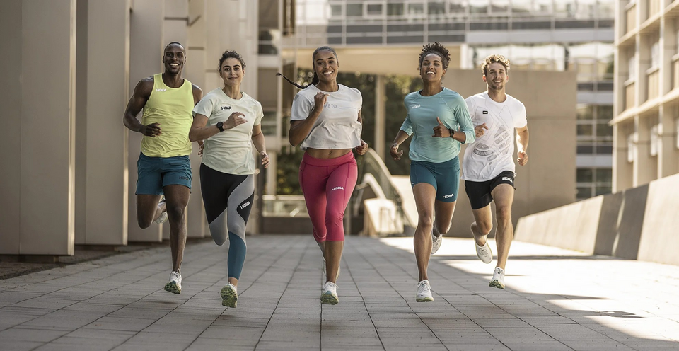Runners in Hoka running shoes on road — Clifton vs Bondi comparison guide at Xciter Sports