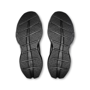 Outsoles of men's On Cloudrunner 3 Max running shoes in Black | Black, showing the road tread.