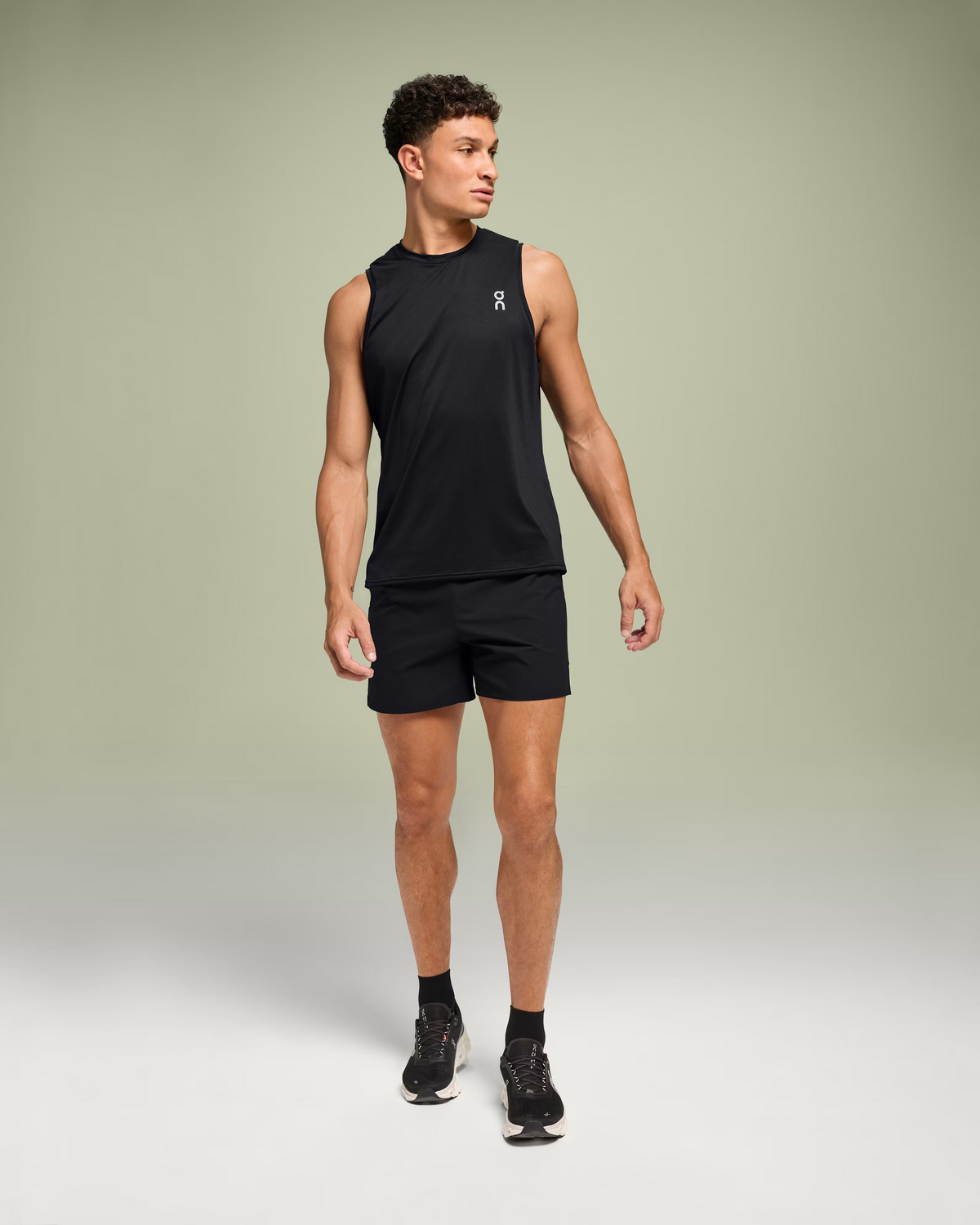 On Core Tank men's black running tank in lightweight recycled polyester and elastane.