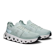 Pair of On Cloudswift 4 women's Surf | White road running shoes in angled three-quarter view