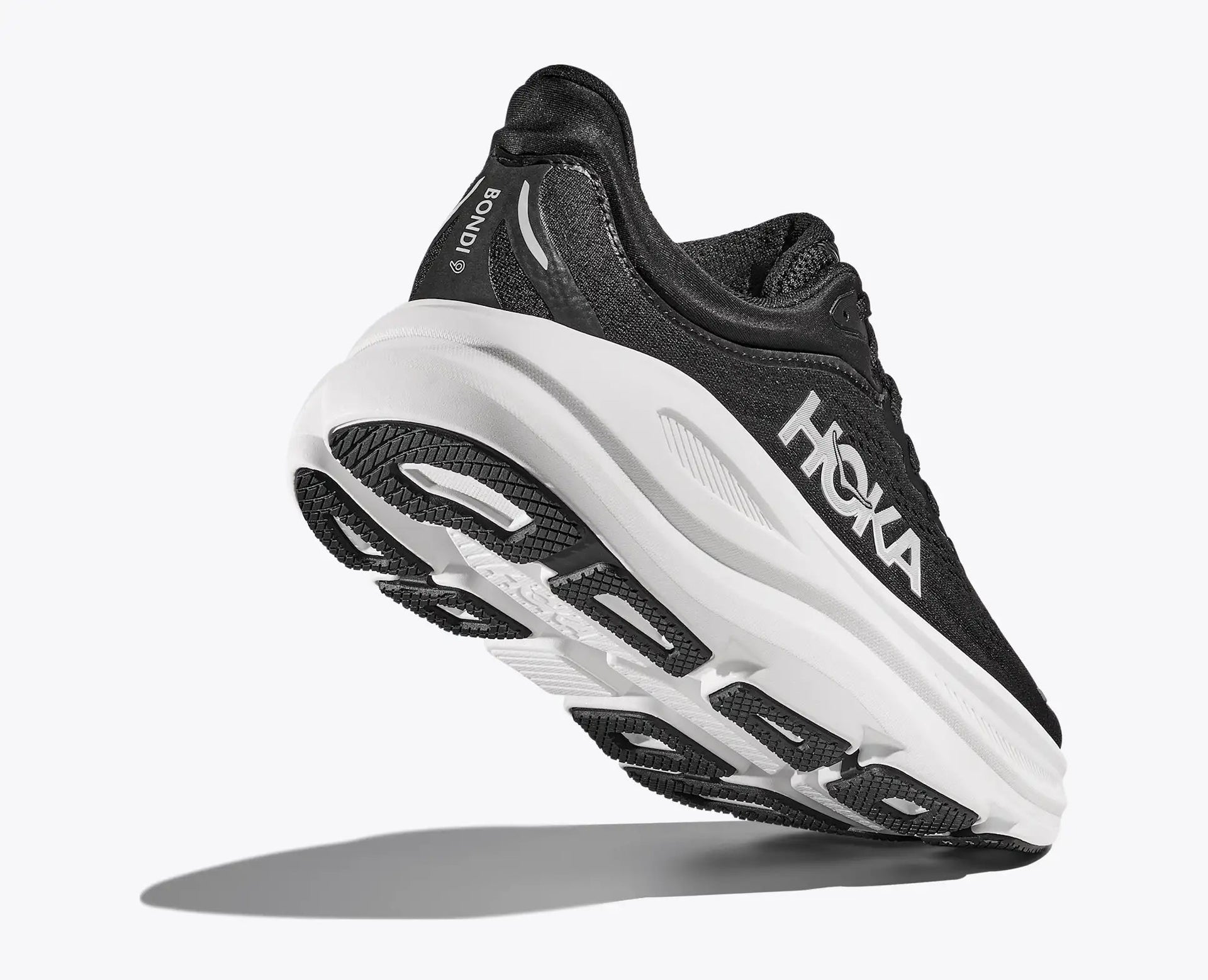 HOKA Bondi 9 Men's Running Shoe - Black/White | Maximum Cushion Road Running - Lifestyle View