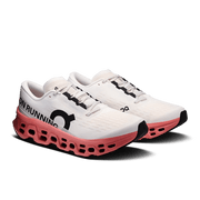 Pair of men’s On Cloudmonster 3 running shoes in Ivory/Dustrose, three-quarter view.