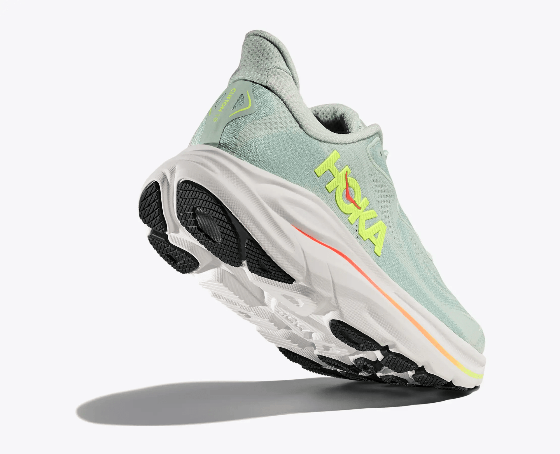 Hoka Clifton 10 women's running shoe in Sea Glass / Neon Flame – toe down view